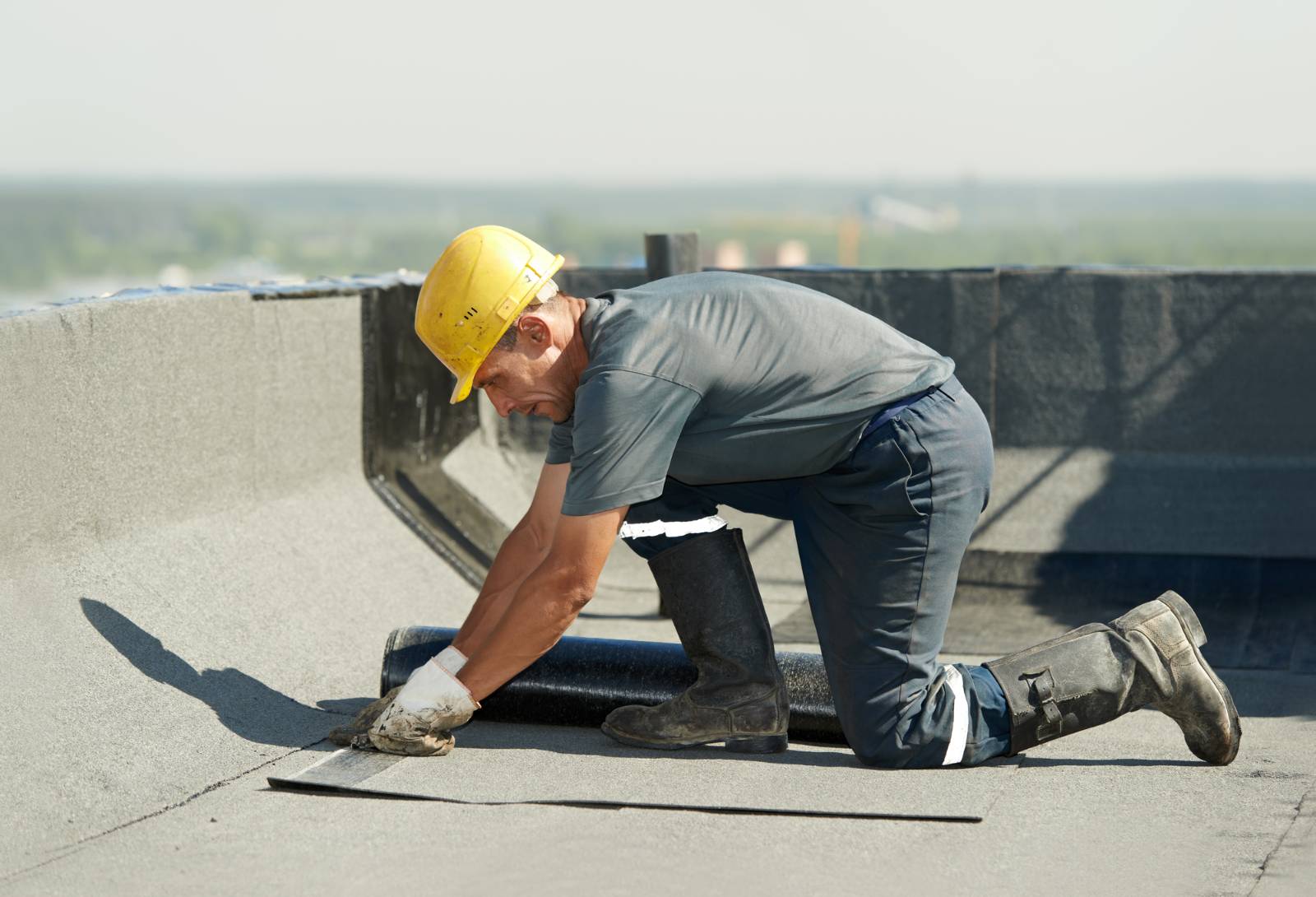 roofer maintaining a commercial roof